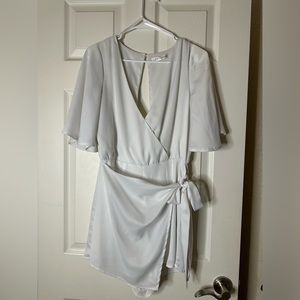 Elegant White Wrap Jumpsuit with Flutter Sleeves